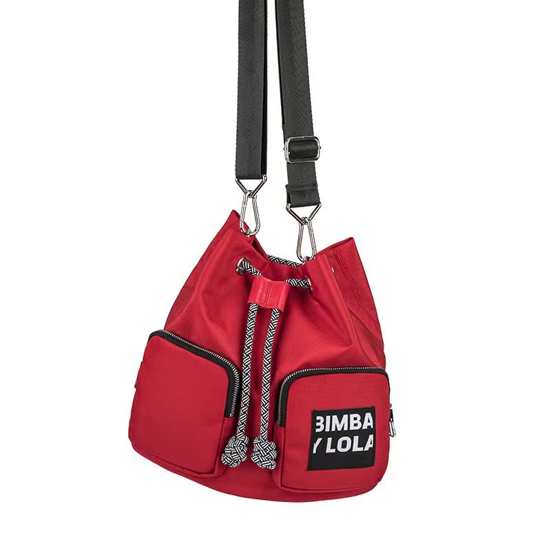 Spanish Lola Spring Diagonal Versatile Letter Backpacks