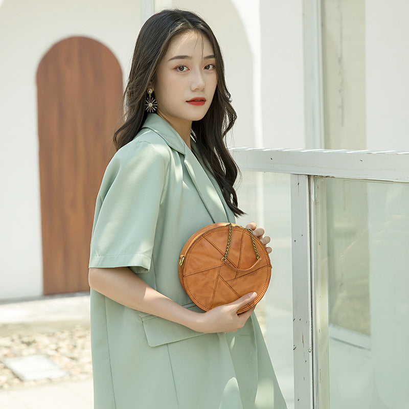 Women's Vegetable Tanned Leather Cow Hand Grip Pattern Round Vintage Bags
